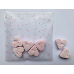 traktatiezakje roze witte stipjes